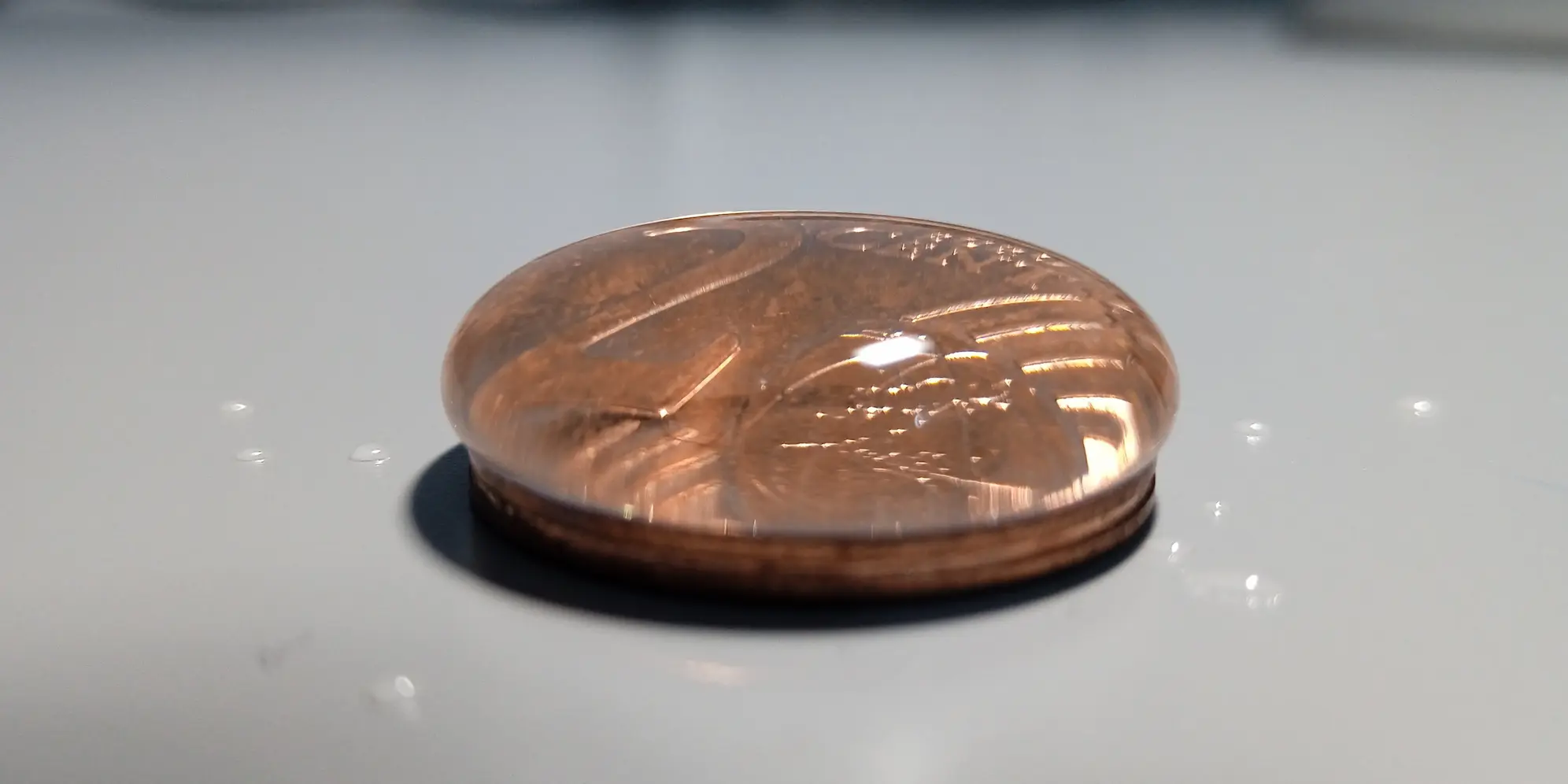 How Many Drops Fit on a Coin?